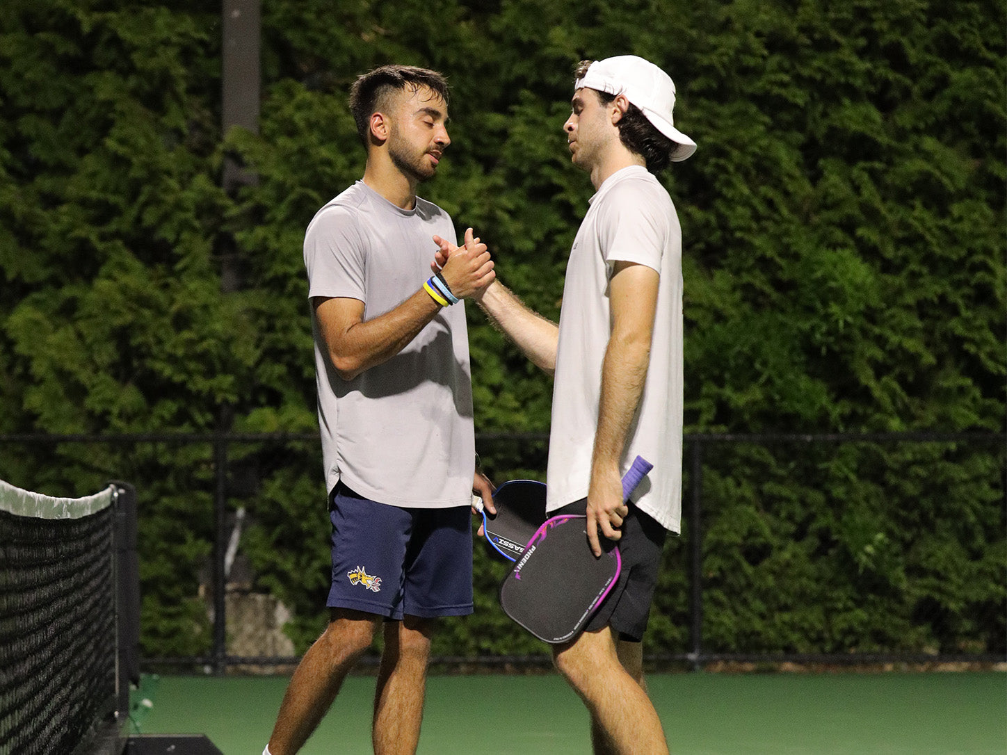 Pickleball players connecting on the court after a game